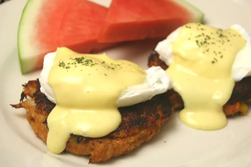 Crabcake Benedict with hollandaise and watermelon