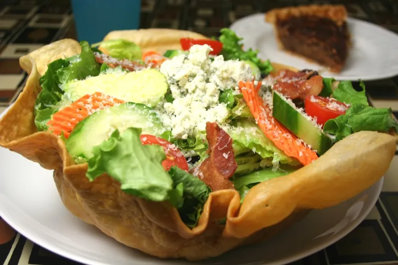 Crabapple Cobb salad in a crisp tortilla basket with a slice of pie